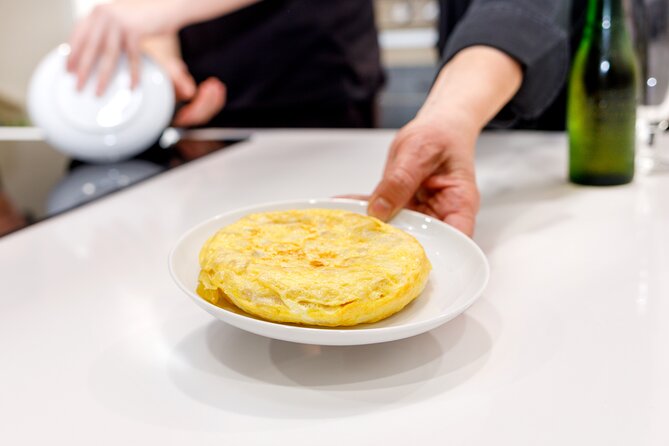 Authentic Tapas Cooking Class at a Private Local Eatery in Madrid - Croquettes, paella with black ink, and two sides that show range