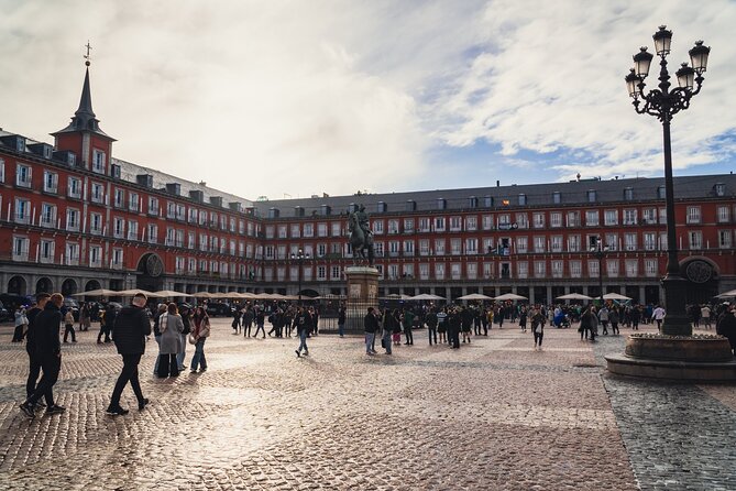 Imperial Madrid Private Journey through the Austrias - Plaza Mayor: the grand square feeling Madrid in real time