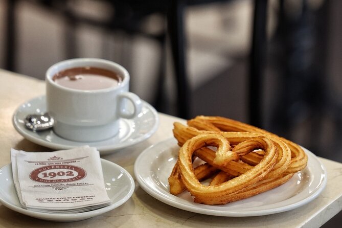 Madrid Bike Tour with Churros and Wine, Ham, and Cheese Upgrade - The Fountain of the Fallen Angel: a rare sculpture story