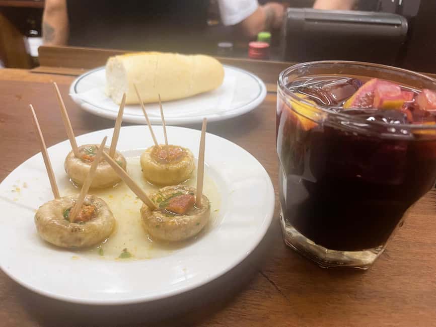 Madrid: Food Tour of Hidden Gems – Small Group Experience - Tortilla madrileña finale in a historic setting: the last bite that lingers