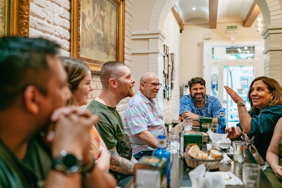 Madrid: Food & Wine Tour with 10 Tapas & 4 Drinks Included - The four stops in 150 minutes: market, neighborhood bar, slow-food tavern, bodega