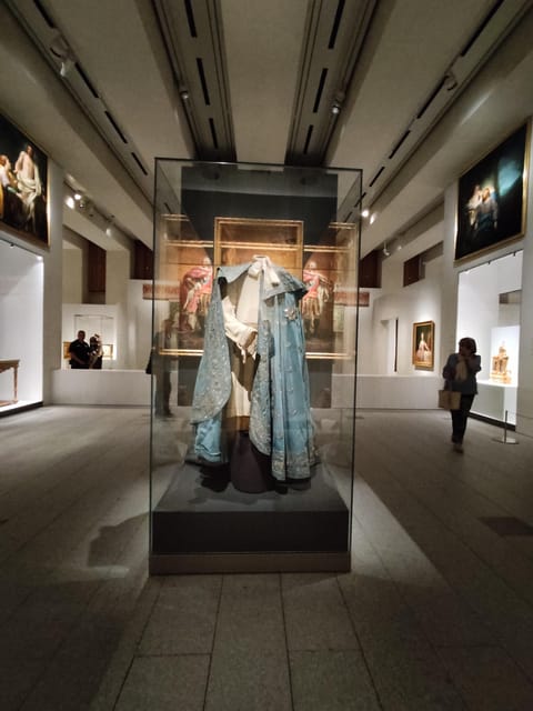 Madrid: Guided Tour of the Royal Collections Gallery - Bourbon level: clocks, furniture, a carriage, and wartime prison photographs