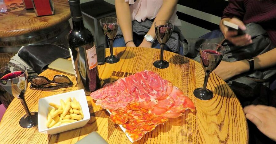 Madrid: Iberico Ham and Spanish Wine Small-Group Food Tour - Stop 2: Jamonerías where you learn ham types the practical way