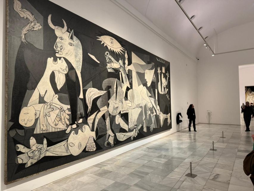 Madrid: Reina Sofia and Prado Museum Tickets and Guided Tour - Finding the group: Real Reina Sofía meeting point and the white umbrella cue