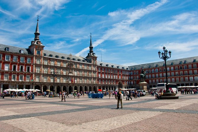Madrid Sightseeing Tour with Royal Palace Skip the Line Ticket - Plaza Mayor and Puerta del Sol: Why These Stops Work