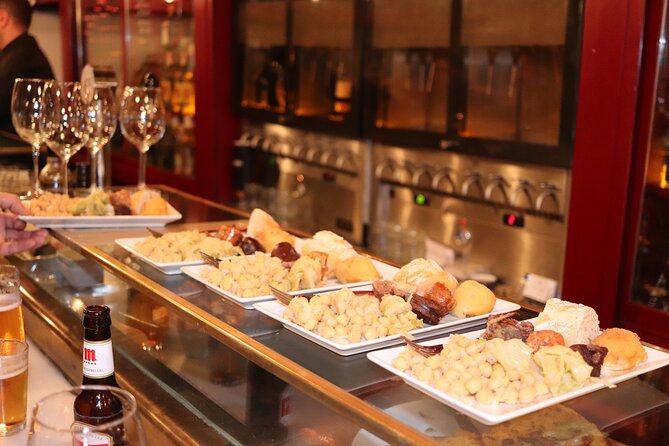 Madrid Small Group Tapas Tour at 4 Venues -Lunch or Dinner - Finishing at Chocolatería San Ginés: churros and dark chocolate payoff