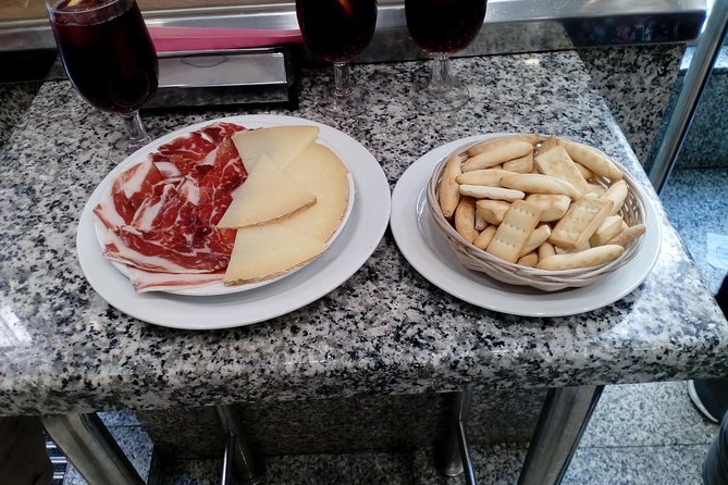 Madrid Tapas & Drinks: A Small Group Culinary Adventure - Tablao Flamenco Arco de Cuchilleros Stop: Medieval Streets and a Classic Bar Bite