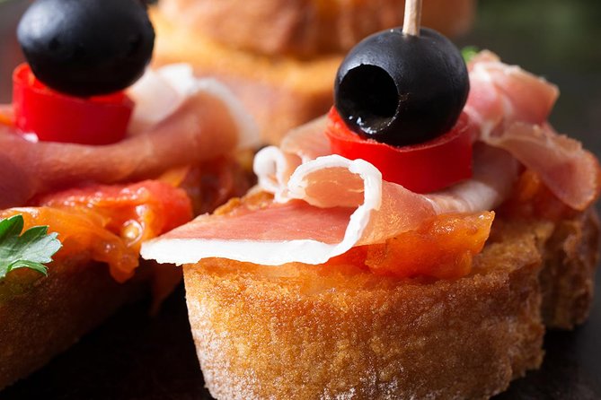 Madrid Tapas Experience Walking Tour - Stop 1 at SANDEMANs New Europe: paella, croquettes, and the wineskin lesson