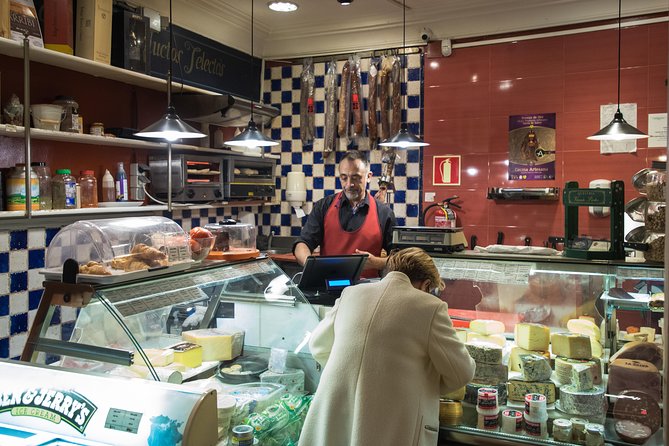 Madrid Tapas & Wine Tasting Walking Tour – Small Group Local Bars - Stop 3: Plaza del Ángel and a wine bar/store hidden behind bottles