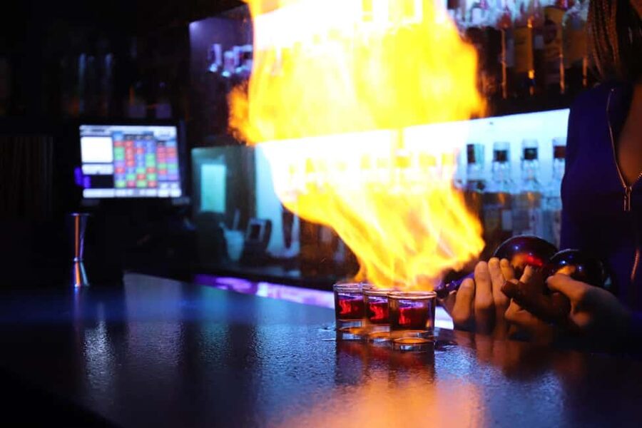 Madrid: Top Pub Crawl with Drinks and Free Nightclub Entry - Las Letras Quarter: Dance Show Energy in a Playful Neighborhood