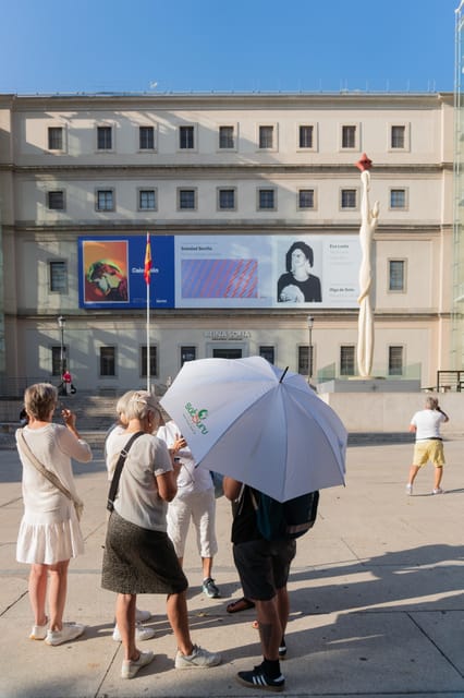 Private Guided tour Afternoon Art Delight at Reina Sofía - Meeting point by the crystal elevators and the white umbrella