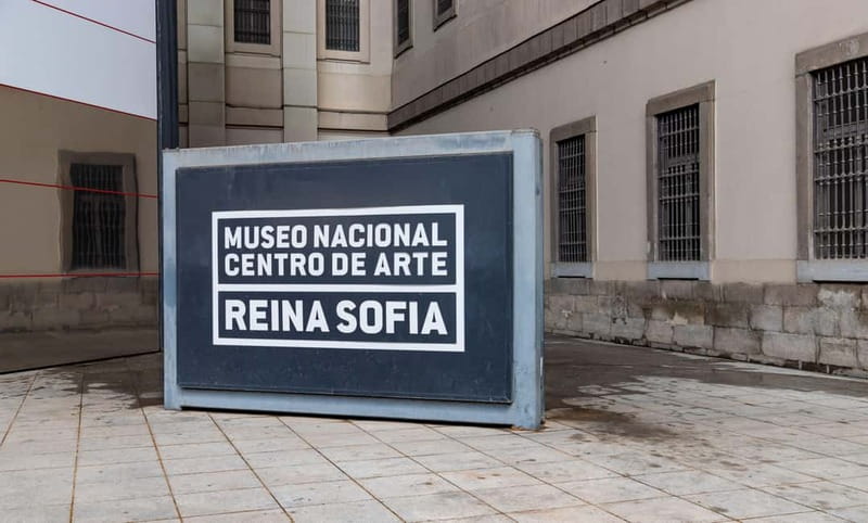 Reina Sofía Museum - Guided tour IN ITALIAN with family discount. - Meeting under the blue umbrella: starting smoothly (and on time)