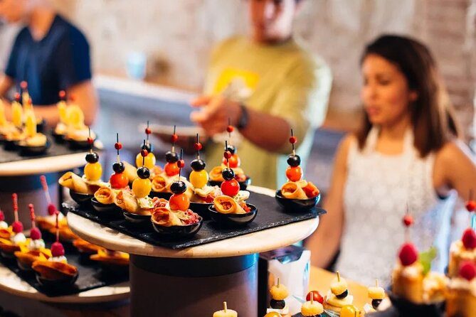 Tasty Tapas & Drinks Tour with a Rooftop Included - Meeting at Taberna Tirso de Molina and finishing near Plaza de España