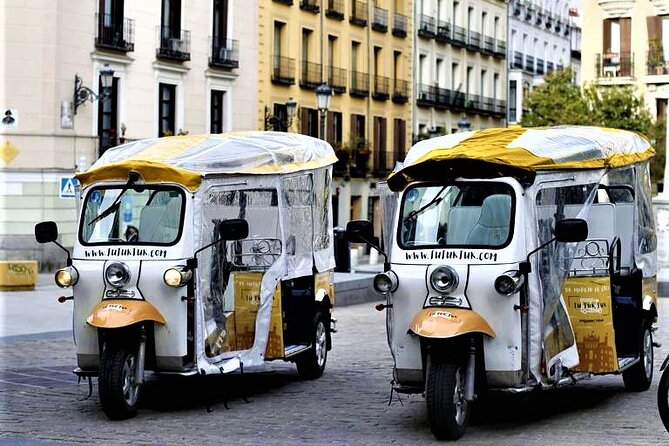 Tour of Historic and Modern Madrid with a guide in a yellow tuk tuk - Plaza de Isabel II to Madrid Cathedral: your landmark anchor
