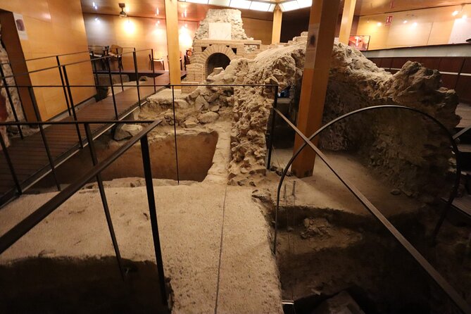 Underground Toledo Private Walking Tour with Official Local Guide - Entering Cuevas de Hércules: Roman Cisterns, a Mosque, Then a Church