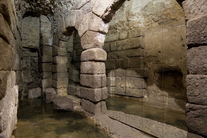 Visit to the Toledo Underground - Casa Palacio Rodrigo de la Fuente: walled foundations under a protected site