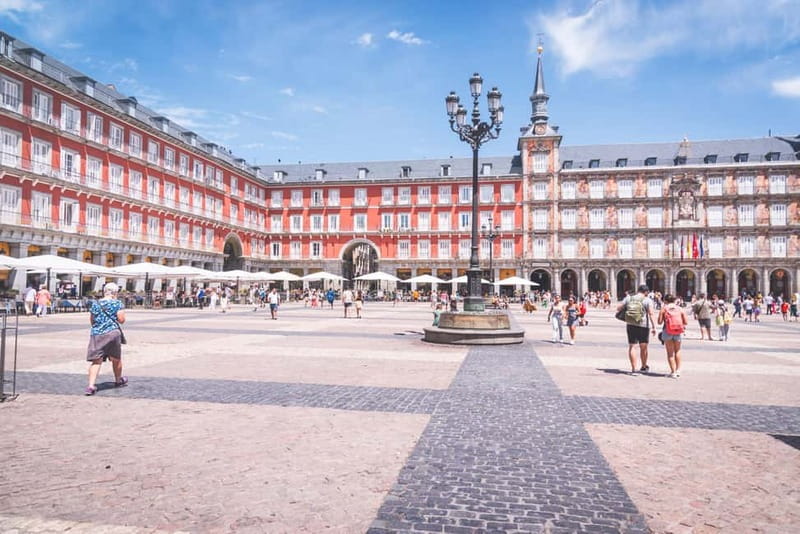 Walking Tour Madrid +Pintxo +Drink - Market time and the neighborhood shop: what you learn beyond landmarks